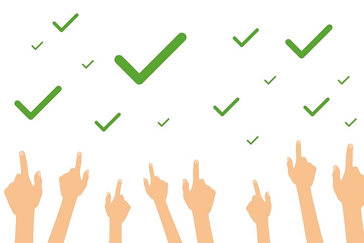 Hände zeigen auf viele grüne Hakerl